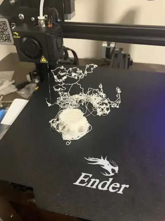 Photo of a model printed halfway through with 'spaghetti'