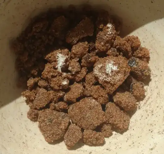 dark brown sugar with white and dark areas