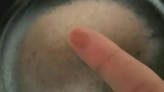 An index finder with the same light-brown substance from the pan on it.