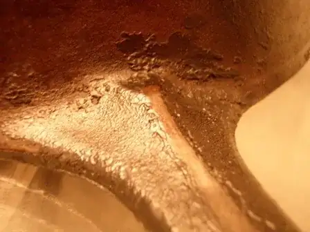 Back of Pan, under handle