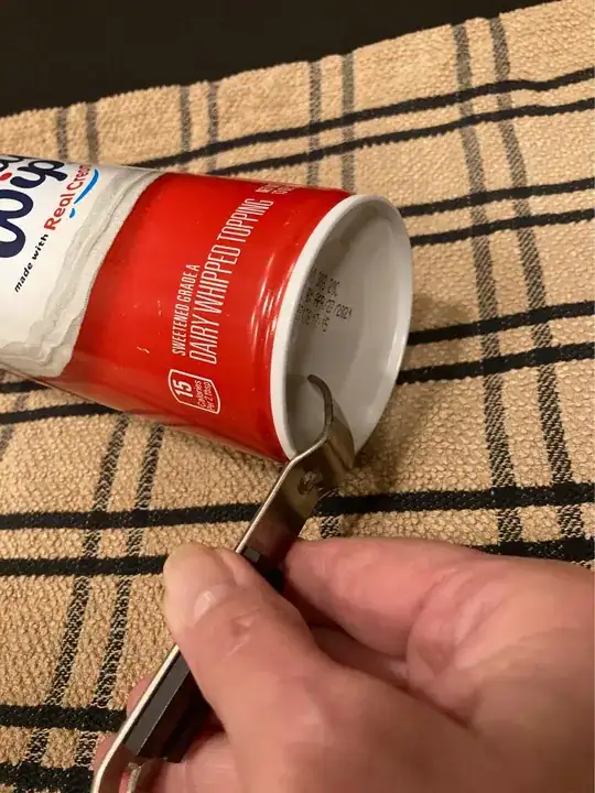 whipped cream canister laying on counter