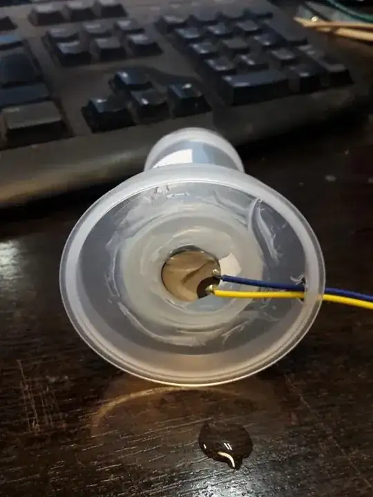 Ultrasonic transducer mounted under a water tank