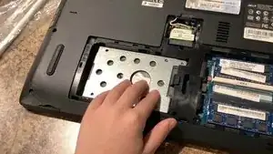 Take out the Phillips head screws