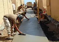 Cement based concrete, forming a large surface, typically cast in placesurface=concrete