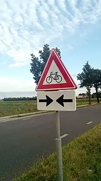 A sign warning of crossing cyclists in the Netherlands.traff_sign=hazard + highway=crossing + hazard=bicycle