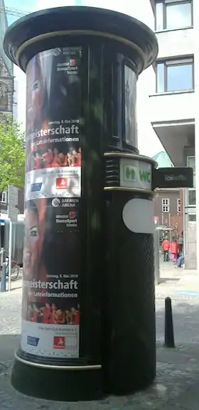 A toilette hidden in an advertising column