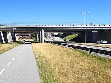 guard_rail – a guard rail or crash barrier. Could be a common value to use on street ways/motor vehicle lanes as well.