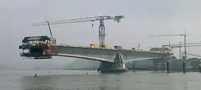 The Pierre Pflimlin bridge being constructed over the river Rhine between Germany and France.