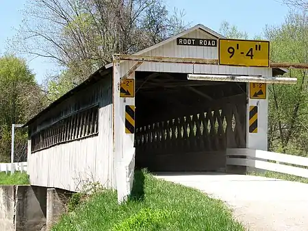 United States (Ohio):name=Root Road Covered BridgeOn the roadway:bridge:name=Root Road Covered Bridgelanes=1maxheight=9'4"maxheight:conditional=9'4" @ (width<6'); 8'2" @ (width>=6')