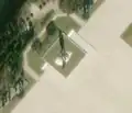 2/4 The same statue of Kim Il-sung (artwork_type=status and tourism=artwork) on its white base with the trees in the background which leaves a long shadow on the satellite imagery (satelliteimage Maxar).
