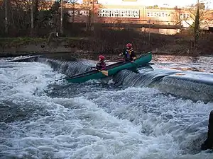 A (non-movable) weir navigated by canoeists