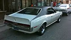 Shows a 1970 AMC Javelin featuring optional full black vinyl-covered roof