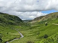 A view into the Abergwesyn valley, looking north-west. The river Irfon can be seen in the centre of the valley.