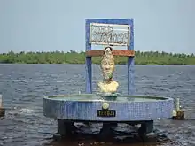 A statue of Yemaya above water