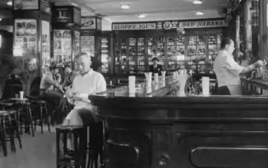 Actor Alec Guinness on set of "Our Man in Havana," filmed at Sloppy Joe's in 1958.