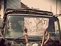 Students protests against the imposition of vat in their tuition fees by upholding the placard in front of Army vehicle.