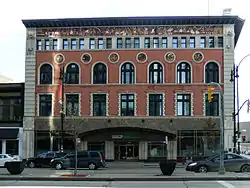 Four-story building with a red-brick facade