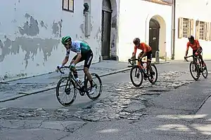 Cyclists passing through the Upper Town of Zagreb on Stage 6