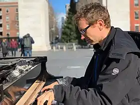 Huggins playing piano in Washington Square Park in January 2019