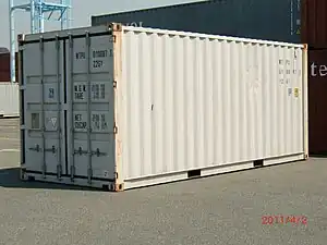 Standard 20-foot ISO shipping container with standard corner castings on each of its eight corners.