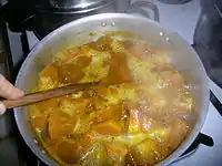 Smashing cubes in the pot.