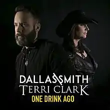 A bearded man facing left and a woman in a black cowboy hat facing right, both in profile, against a black background