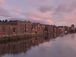 Brick buildings on the riverside in the city of York at sunrise