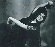 Doris Niles, smiling in a Spanish dance pose, from a 1922 issue of Broadway Brevities