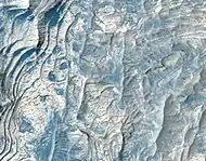 Close, color view of layers in Schiaparelli Crater, as seen by HiRISE under HiWish program Dark sand is visible on some layers.