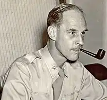 Black and white 1941 head and shoulders photo of brigadier General Edward J. Stackpole in duty uniform and necktie, with smoking pipe at left corner of mouth