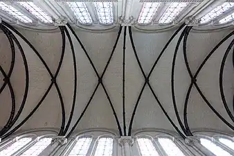 The exposed iron ribs of the vaults