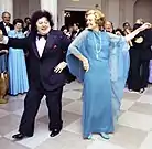 Ford dancing with comedian Marty Allen in the Entrance Hall of the White House of the White House during a September 21, 1976 state dinner in honor Liberian President William Tolbert