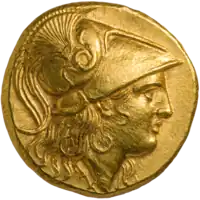 One side of a gold coin of Alexander the Great. The obverse, depicted, shows his profile in armor.