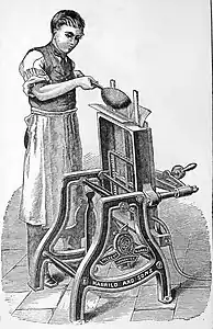 Pouring molten type metal into the casting box.