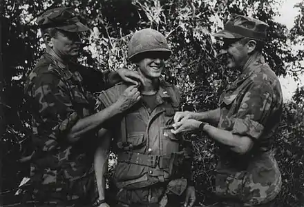A United States Marine receives a promotion to first lieutenant
