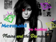A black-and-white photograph of Marina Diamandis staring into the camera surrounded by diamond-shaped clipart.