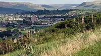 Looking east from Werneth Low towards Mottram with the hills of the Peak District in the background.