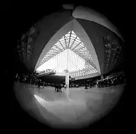 An image of the Louvre museum entry taken with the 7.5 mm f/5.6 circular fisheye Nikkor lens