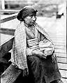 A Nuu-chah-nulth woman selling baskets in Nootka Sound in the 1930s