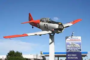 A former RNZAF North American Harvard mounted outside the Air Force Museum of New Zealand, a prominent feature of Sockburn