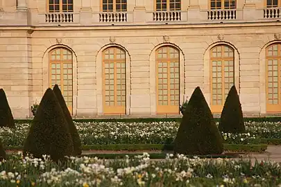 Baroque mascarons of various ages above doors of the garden facade of the Palace of Versailles, sculpted by Gaspard and Balthazard Marsy, Pierre Ier Le Gros, Benoît  Massou and others, mostly from 1673-1674