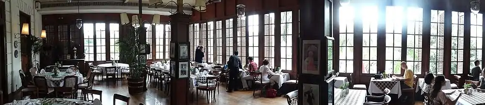 The wide shuttered wooden window of the gallery.