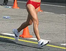 Image 26A racewalker "flying" (entirely out of contact with the ground, a rule violation) (from Racewalking)