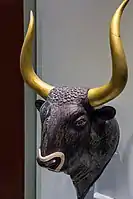 Stone rhyton in the form of a bulls head, Knossos, LM I or II.  The gilt-wood horns are modern.