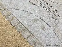 A granite slab with several names carve into it, including Jessie Stephen