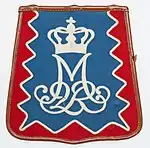 A current Danish sabretache for enlisted, carrying the cypher of Margrethe II.