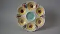 Oyster plate, 9.6 ins., coloured glazes, c. 1881, sunflower pattern.