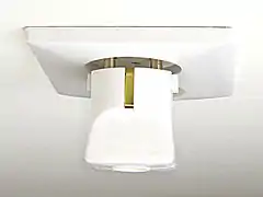 CEE 7/4 plug partially inserted in CEE 7/1 non-earthed socket, pins are in contact but exposed.  There is no connection for the earthing contact