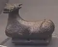 Seated bull bronze pendant