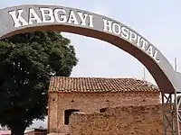 Sign with Colonial-Era Building – Kabgayi Hospital